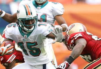 MIAMI - DECEMBER 14:  Wide receiver Davone Bess #15 of the Miami Dolphins breaks through for extra yardage on a kick return while taking on the San Francisco 49ers at Dolphin Stadium on December 14, 2008 in Miami, Florida. The Dolphins defeated the 49ers 14-9.  (Photo by Doug Benc/Getty Images)