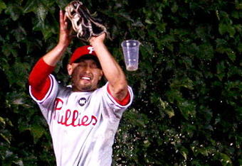 CHICAGO - AUGUST 12: (ALTERNATIVE CROP) Shane Victorino #8 of the Philadelphia Phillies is hit by a beer thrown by a fan in the bleachers as he makes a catch of a fly ball hit by Jake Fox of the Chicago Cubs in the 5th inning on August 12, 2009 at Wrigley Field in Chicago, Illinois.  (Photo by Jonathan Daniel/Getty Images)