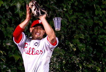 CHICAGO - AUGUST 12: (ALTERNATIVE CROP) Shane Victorino #8 of the Philadelphia Phillies is hit by a beer thrown by a fan in the bleachers as he makes a catch of a fly ball hit by Jake Fox of the Chicago Cubs in the 5th inning on August 12, 2009 at Wrigley Field in Chicago, Illinois.  (Photo by Jonathan Daniel/Getty Images)
