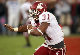 LOS ANGELES - SEPTEMBER 22: Dwight Tardy #31 of the Washington State Cougars carries the ball during the game against the USC Trojans on September 22, 2007 at the Los Angeles Coliseum in Los Angeles, California.  (Photo by Stephen Dunn/Getty Images)