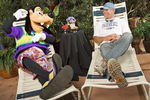 LAKE BUENA VISTA, FL - FEBRUARY 28:  In this handout photo provided by Disney , Brett Favre, who recently announced his retirement, lounges with Goofy on February 28, 2009 at Walt Disney World Resort in Lake Buena Vista, Florida. Favre, who holds multiple NFL records including most passing yards in a career, is at Walt Disney World this weekend for 'ESPN The Weekend,' a sports-themed fan event held at Disney's Hollywood Studios theme park.  (Photo by Matt Stroshane/Disney Via Getty Images)