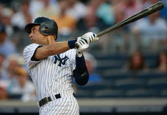 NEW YORK - AUGUST 10:  Derek Jeter #2 of the New York Yankees hits a home run in the first inning during the game on August 10, 2009 at Yankee Stadium in the Bronx Borough of New York City. (Photo by Jared Wickerham/Getty Images)