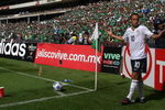 MEXICO CITY - AUGUST 12: Landon Donovan #10 of the USA has trash thrown on him as he attempts a corner kick during the FIFA World Cup Qualifying soccer match between the USA and Mexico at Azteco Stadium August 12, 2009 in Mexico City, Mexico. USA lost 2-1. (Donald Miralle/Getty Images)