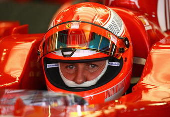 BARCELONA, SPAIN - FEBRUARY 25:  Michael Schumacher of Germany and Ferrari looks on from the pits during day one of the Formula One Testing at the Circuit de Catalunya on February 25, 2008 in Barcelona, Spain.  (Photo by Ryan Pierse/Getty Images)