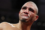 NEW YORK - JUNE 13:  Miguel Cotto fights with a cut after an accidental  head butt by Joshua Clottey during their WBO Welterweight title fight at Madison Square Garden  on June 13, 2009 in New York, New York.  (Photo by Al Bello/Getty Images)