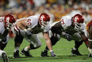 MIAMI - JANUARY 4:  Offensive linemen Wes Sims #60 and Davin Joseph #77 of the Oklahoma Sooners line up against the USC Trojans in the 2005 FedEx Orange Bowl National Championship on January 4, 2005 at Pro Player Stadium in Miami, Florida. USC defeated Oklahoma 55-19. (Photo by Brian Bahr/Getty Images)