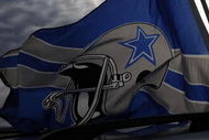 IRVING, TX - DECEMBER 20:  Dallas Cowboys flags fly outside Texas Stadium before the last home game against the Baltimore Ravens on December 20, 2008 in Irving, Texas. The Cowboys are playing their final regular season home game before moving to a new stadium in Arlington, Texas next season.  (Photo by Ronald Martinez/Getty Images)