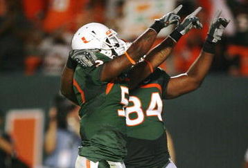 MIAMI - NOVEMBER 13:  Javarris James #5 and tight end Richard Gordon #84 of the Miami Hurricanes celebrate after James' touchdown against the Virginia Tech Hokies at Dolphin Stadium on November 13, 2008 in Miami, Florida. Miami defeated Virginia Tech 16-14.  (Photo by Doug Benc/Getty Images)