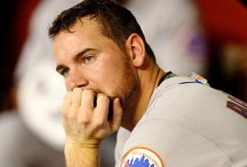 PHOENIX - AUGUST 10:  Starting pitcher Mike Pelfrey #34 of the New York Mets looks on from the dugout during the game against the Arizona Diamondbacks at Chase Field on August 10, 2009 in Phoenix, Arizona. (Photo by Christian Petersen/Getty Images)
