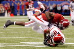 NEW ORLEANS - JANUARY 02:  Defensive back Robert Johnson #17 of the Utah Utes is hit by receiver Julio Jones #8 of the Alabama Crimson Tide as Johnson drops the interception attempt in the second quarter during the 75th Allstate Sugar Bowl at the Louisiana Superdome on January 2, 2009 in New Orleans, Louisiana.  (Photo by Chris Graythen/Getty Images)