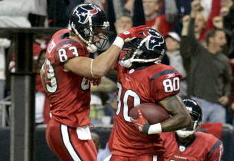 HOUSTON - DECEMBER 13:  Kevin Walter #83 celebrates a touchdown with Andre Johnson #80 of the Houston Texans during the NFL game against the Denver Broncos at  Reliant Stadium on December 13, 2007 in Houston, Texas. (Photo by Thomas B.  Shea/Getty Images)