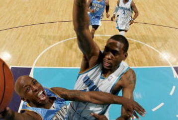 NEW ORLEANS - APRIL 27:  Chauncey Billups #7 of the Denver Nuggets makes a shot over Rasual Butler #45 of the New Orleans Hornets in Game Four of the Western Conference Quarterfinals during the 2009 NBA Playoffs at New Orleans Arena on April 27, 2009 in New Orleans, Louisiana.  The Nuggets defeated the Hornets 121-63.   NOTE TO USER: User expressly acknowledges and agrees that, by downloading and or using this photograph, User is consenting to the terms and conditions of the Getty Images License Agreement.  (Photo by Chris Graythen/Getty Images)