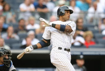 NEW YORK - AUGUST 12:  Robinson Cano #24 of the New York Yankees hits the game winning single against the Toronto Blue Jays during the MLB game on August 12, 2009 at Yankee Stadium in the Bronx borough of New York City.  The Yankees won 4-3 in 11 innings. (Photo by Nick Laham/Getty Images)