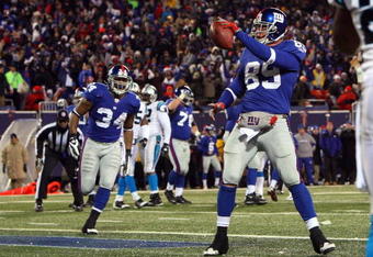 EAST RUTHERFORD, NJ - DECEMBER 21:  Tight end Kevin Boss #89 of the New York Giants celebrates his touchdown against the Carolina Panthers on December 21, 2008 at Giants Stadium in East Rutherford, New Jersey. (Photo by Jim McIsaac/Getty Images)