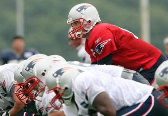 FOXBORO, MA - JULY 31:  Quarterback Tom Brady #12 of the New England Patriots lines up during training camp on July 31, 2009 at Gillette Stadium in Foxboro, Massachusetts.  (Photo by Elsa/Getty Images)