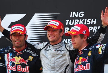 ISTANBUL, TURKEY - JUNE 07:  Second placed Mark Webber (L) of Australia and Red Bull Racing, third placed Sebastian Vettel (L) of Germany and Red Bull Racing and race winner Jenson Button (C) of Great Britain and Brawn GP celebrate on the podium after the Turkish Formula One Grand Prix at Istanbul Park on June 7, 2009, in Istanbul, Turkey.  (Photo by Clive Mason/Getty Images)