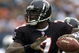 30 Dec 2001: Michael Vick # 7 of the Atlanta Falcons looks for an open man down field against the Miami Dolphins in the second quarter at Pro Player Stadium in Miami Florida. DIGITAL IMAGE. Mandatory Credit: Eliot Schechter/Getty Images