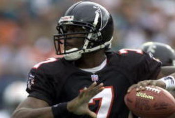 30 Dec 2001: Michael Vick # 7 of the Atlanta Falcons looks for an open man down field against the Miami Dolphins in the second quarter at Pro Player Stadium in Miami Florida. DIGITAL IMAGE. Mandatory Credit: Eliot Schechter/Getty Images