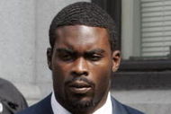 RICHMOND, VA - AUGUST 27:  Atlanta Falcons quarterback Michael Vick (R) leaves federal court August 27, 2007 in Richmond, Viriginia. Vick pleaded guilty to a federal dogfighting charge.  (Photo by Steve Helber-Pool/Getty Images)