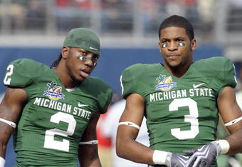 ORLANDO, FL - JANUARY 1: Wide receivers B. J. Cunningham #3 and Mark Dell #2 of the Michigan State Spartans warm up before play against the Georgia Bulldogs at the 2009 Capital One Bowl at the Citrus Bowl on January 1, 2009 in Orlando, Florida.  (Photo by Al Messerschmidt/Getty Images) 