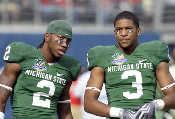 ORLANDO, FL - JANUARY 1: Wide receivers B. J. Cunningham #3 and Mark Dell #2 of the Michigan State Spartans warm up before play against the Georgia Bulldogs at the 2009 Capital One Bowl at the Citrus Bowl on January 1, 2009 in Orlando, Florida.  (Photo by Al Messerschmidt/Getty Images) 