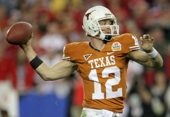 GLENDALE, AZ - JANUARY 05:  Quarterback Colt McCoy #12 of the Texas Longhorns drops back to pass during the Tostitos Fiesta Bowl Game against the Ohio State Buckeyes on January 5, 2009 at University of Phoenix Stadium in Glendale, Arizona.  (Photo by Doug Pensinger/Getty Images)