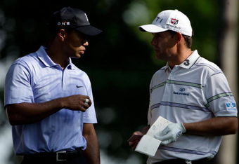 CHASKA, MN - AUGUST 13:  Tiger Woods and Padraig Harrington of Ireland wait together on the 12th tee during the first round of the 91st PGA Championship at Hazeltine National Golf Club on August 13, 2009 in Chaska, Minnesota.  (Photo by Jamie Squire/Getty Images)