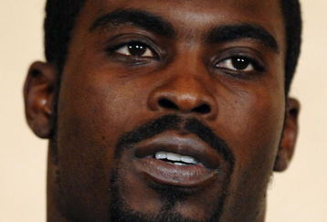 RICHMOND, VA - AUGUST 27:  Atlanta Falcons quarterback Michael Vick speaks to reporters at the Omni Richmond Hotel after agreeing to a guilty plea on charges stemming from his involvement in a dogfighting ring August 27, 2007, in Richmond, Virginia.  (Photo by Jonathan Ernst/Getty Images)