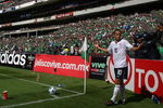 MEXICO CITY - AUGUST 12: Landon Donovan #10 of the USA has trash thrown on him as he attempts a corner kick during the FIFA World Cup Qualifying soccer match between the USA and Mexico at Azteco Stadium August 12, 2009 in Mexico City, Mexico. USA lost 2-1. (Donald Miralle/Getty Images)
