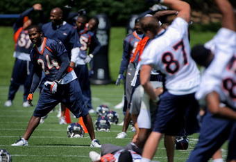 ENGLEWOOD, CO - JUNE 12:  Cornerback Champ Bailey #24 of the Denver Broncos stretches with his teammates as he participates in minicamp practice at the Broncos Dove Valley training facility on June 12, 2009 in Englewood, Colorado.  (Photo by Doug Pensinger/Getty Images)