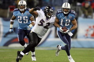 NASHVILLE, TN - JANUARY 10:  Wide receiver Justin Gage #12 of the Tennessee Titans looks to avoid a tackle by Ray Lewis #52 of the Baltimore Ravens in the second quarter during the AFC Divisional Playoff Game on January 10, 2009 at LP Field in Nashville, Tennessee.  (Photo by Andy Lyons/Getty Images)