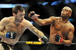 PHILADELPHIA - AUGUST 08:  Anderson Silva (R) throws a right punch to Forrest Griffin during their light heavyweight bout at UFC 101: Declaration at the Wachovia Center on August 8, 2009 in Philadelphia, Pennsylvania.  (Photo by Jon Kopaloff/Getty Images)