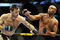 PHILADELPHIA - AUGUST 08:  Anderson Silva (R) throws a right punch to Forrest Griffin during their light heavyweight bout at UFC 101: Declaration at the Wachovia Center on August 8, 2009 in Philadelphia, Pennsylvania.  (Photo by Jon Kopaloff/Getty Images)