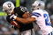 OAKLAND, CA - AUGUST 13: Chaz Schilens #81 of the Oakland Raiders catches a pass over Courtney Brown #27 of the Dallas Cowboys during a preseason game at Oakland-Alameda County Coliseum on August 13, 2009 in Oakland, California.  (Photo by Jed Jacobsohn/Getty Images)