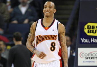 OAKLAND, CA - MARCH 30:  Monta Ellis #8 of the Golden State Warriors looks on against the Memphis Grizzlies during an NBA game on March 30, 2009 at Oracle Arena in Oakland, California. NOTE TO USER: User expressly acknowledges and agrees that, by downloading and or using this photograph, User is consenting to the terms and conditions of the Getty Images License Agreement.  (Photo by Jed Jacobsohn/Getty Images)