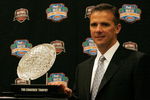 FORT LAUDERDALE, FL - JANUARY 07:  Head coach Urban Meyer of the Florida Gators poses with the 'The Coaches' Trophy' during the FedEx BCS Head Coaches Press Conference at Harbor Beach Marriott Resort & Spa on January 7, 2009 in Fort Lauderdale, Florida.  (Photo by Doug Benc/Getty Images)