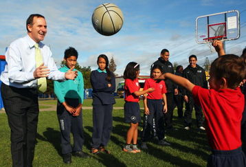 AUCKLAND, NEW ZEALAND - AUGUST 11: New Zealand Prime Minister John Key plays sport with school children at the launch of a new school sports funding initiative from the New Zealand Government at Bairds Mainfreight Primary School, Otara on August 11, 2009 in Auckland, New Zealand. Key announced the Government will spend $82 million over four years getting kids to play school sport.  (Photo by Phil Walter/Getty Images)