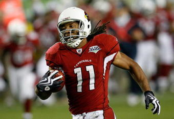 TAMPA, FL - FEBRUARY 01:  Wide receiver Larry Fitzgerald #11 of the Arizona Cardinals scores a 64-yard touchdown reception in the fourth quarter against the Pittsburgh Steelers during Super Bowl XLIII on February 1, 2009 at Raymond James Stadium in Tampa, Florida.  (Photo by Kevin C. Cox/Getty Images)