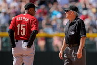 DENVER - MAY 14:  Manager Cecil Cooper #15 of the Houston Astros questions a call with second base umpire Larry Vanover against the Colorado Rockies during MLB action at Coors Field on May 14, 2009 in Denver, Colorado. The Astros defeated the Rockies -3.  (Photo by Doug Pensinger/Getty Images)