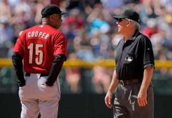 DENVER - MAY 14:  Manager Cecil Cooper #15 of the Houston Astros questions a call with second base umpire Larry Vanover against the Colorado Rockies during MLB action at Coors Field on May 14, 2009 in Denver, Colorado. The Astros defeated the Rockies -3.  (Photo by Doug Pensinger/Getty Images)