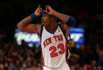 NEW YORK - NOVEMBER 4:  Quentin Richardson #23 of the New York Knicks gestures as he celebrates a play against the Washington Wizards November 4, 2005 at Madison Square Garden in New York, New York. The Wizards defeated the Knicks 86-75.  NOTE TO USER: User expressly acknowledges and agrees that, by downloading and/or using this Photograph, user is consenting to the terms and conditions of the Getty Images License Agreement.  (Photo by Nick Laham/Getty Images) 