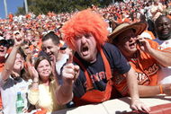 CLEMSON, SC - NOVEMBER 12:  Clemson Tigers fans celebrate a touchdown against the Florida State Seminoles during an Atlantic Coast Conference game on November 12, 2005 at Clemson Memorial Stadium in Clemson, South Carolina.  (Photo by Grant Halverson/Getty Images)