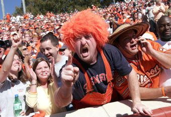 CLEMSON, SC - NOVEMBER 12:  Clemson Tigers fans celebrate a touchdown against the Florida State Seminoles during an Atlantic Coast Conference game on November 12, 2005 at Clemson Memorial Stadium in Clemson, South Carolina.  (Photo by Grant Halverson/Getty Images)