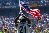 SAN DIEGO - SEPTEMBER 9:  Runningback LaDainian Tomlinson #21 of the San Diego Chargers enters the game with the American flag against the Chicago Bears at Qualcomm Stadium September 9, 2007 in San Diego, California.  (Photo by Donald Miralle/Getty Images)