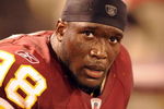 BALTIMORE, MD - AUGUST 13:  Brian Orakpo #98 of the Washington Redskins looks on during a NFL preseason football game against the Baltimore Ravens on August 13, 2009 at M & T Bank Stadium in Baltimore, Maryland.   (Photo by Mitchell Layton/Getty Images)