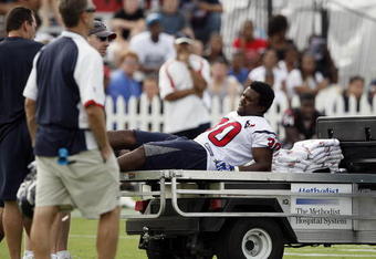 HOUSTON - JULY 31:  Running back Clifton Dawson #30 of the Houston Texans is carted off the field after sustaining a leg injury during Texans training camp on July 31, 2009 in Houston, Texas.  (Photo by Bob Levey/Getty Images)
