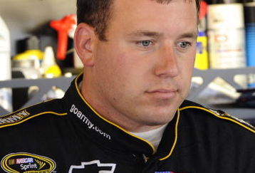 WATKINS GLEN, NY - AUGUST 07:  Ryan Newman, driver of the #39 U.S. Army Chevrolet, stands in the garage during practice for the NASCAR Sprint Cup Series Heluva Good! Sour Cream Dips at Watkins Glen International on August 7, 2009 in Watkins Glen, New York.  (Photo by John Harrelson/Getty Images for NASCAR)