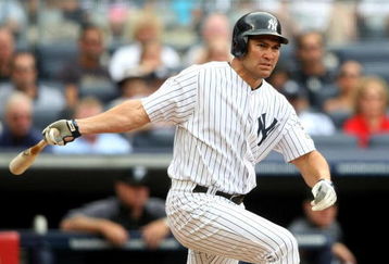 NEW YORK - AUGUST 12:  Johnny Damon #18 of the New York Yankees hits a double in the first inning against the Toronto Blue Jays during the MLB game on August 12, 2009 at Yankee Stadium in the Bronx borough of New York City. (Photo by Nick Laham/Getty Images)