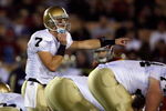 LOS ANGELES, CA - NOVEMBER 29:  Jimmy Clausen #7 of the Notre Dame Fighting Irish calls a play against the USC Trojans during the game at the Coliseum on November 29, 2008 in Los Angeles, California.  (Photo by Harry How/Getty Images)