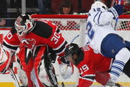 NEWARK, NJ - APRIL 07: Lee Stempniak #12 of the Toronto Maple Leafs is upended by Johnny Oduya #29 of the New Jersey Devils on April 7, 2009 at the Prudential Center in Newark, New Jersey. (Photo by Bruce Bennett/Getty Images)